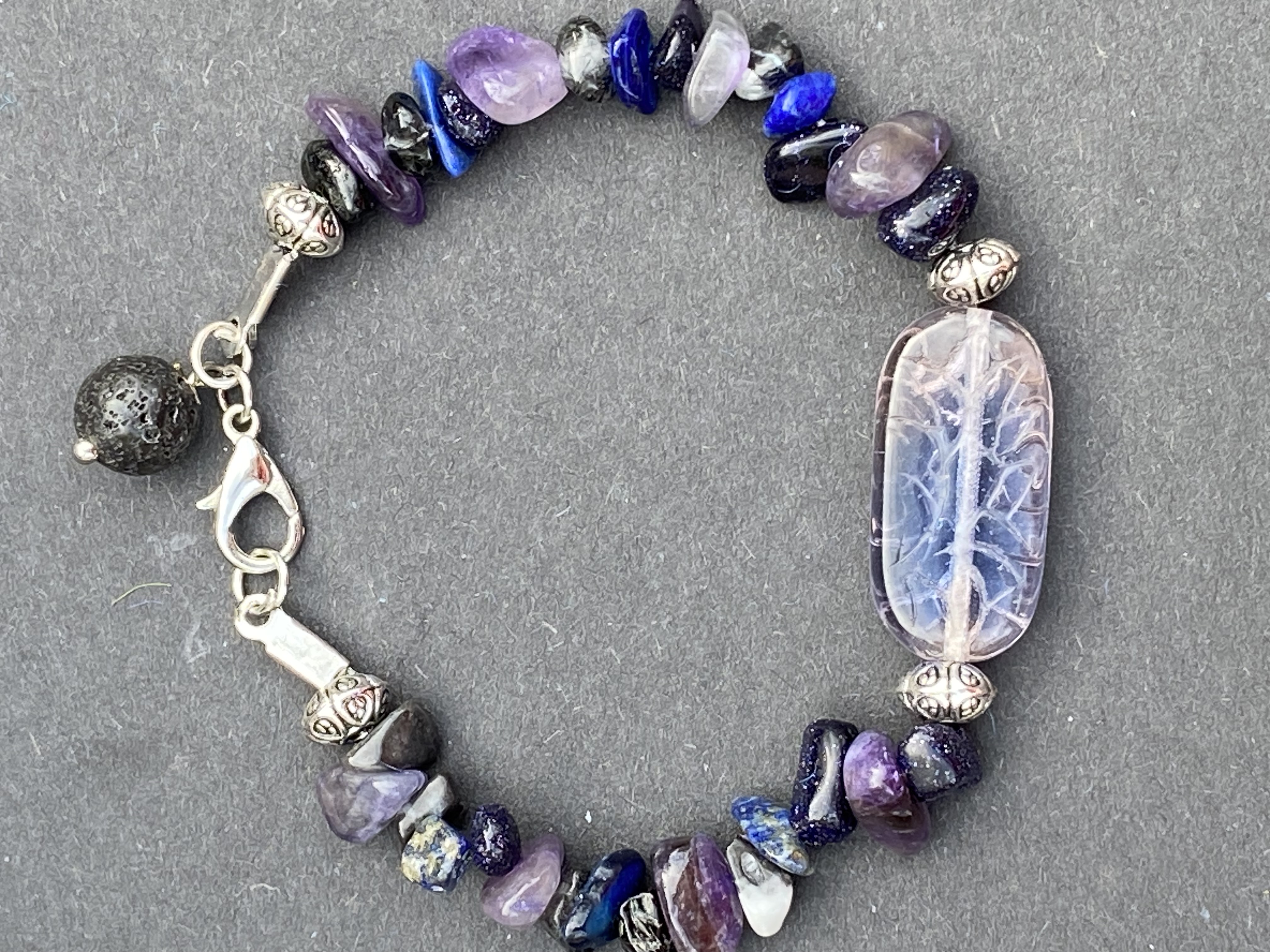Amethyst with glass bead