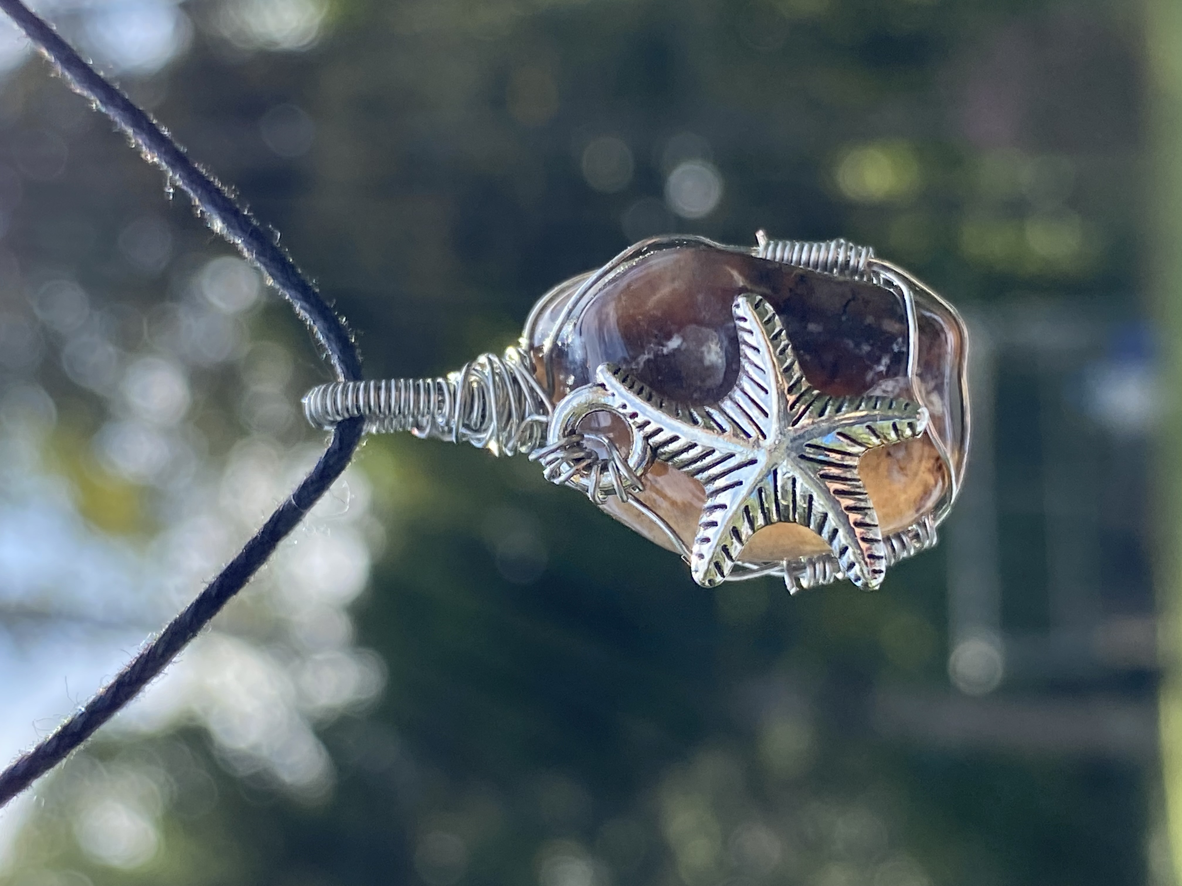 Starfish silver wrapped pendant